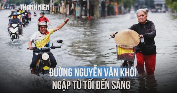 Đường Nguyễn Văn Khối ngập từ tối đến sáng, người dân chật vật dắt xe qua 'biển nước'