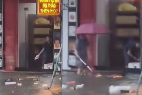 Hành động lạ của người phụ nữ trong thời điểm Vinh mưa to kỷ lục