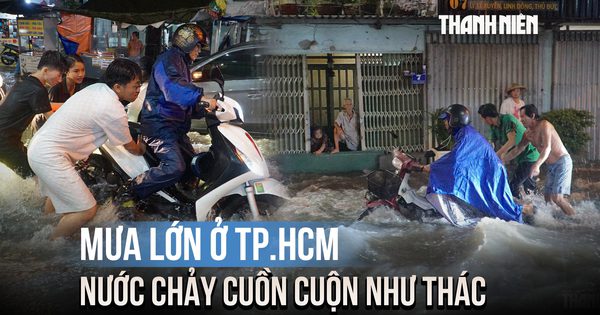 Mưa lớn ở TP.HCM khiến nhiều đường ngập sâu, nước chảy cuồn cuộn như thác