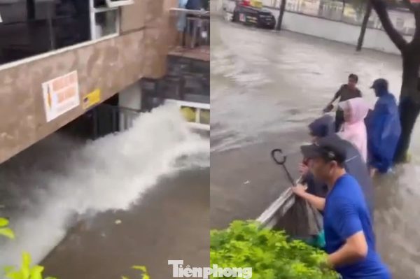 Nước mưa cuồn cuộn như thác tràn vào tầng hầm chung cư ở Nghệ An