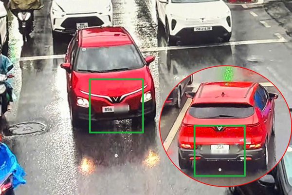 Ô tô gắn 2 biển số khác nhau chạy trên đường ở Hà Nội
